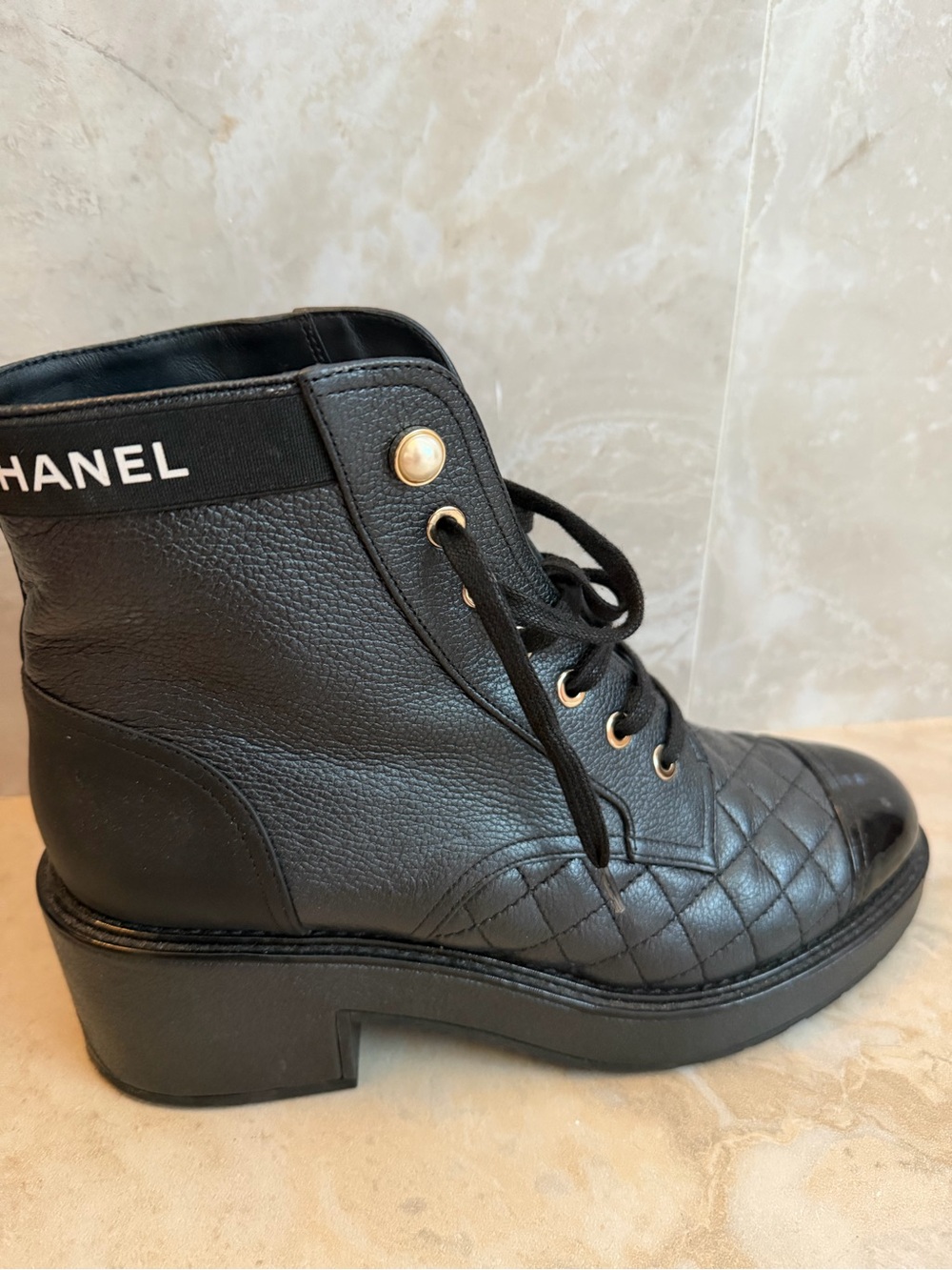 CHANEL Black Quilted Leather Lace-Up Ankle Boots with Gold Eyelets